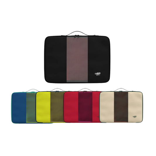 Seven CabinZero packing cubes in assorted colors (black, blue, yellow, olive green, red, burgundy, and beige) arranged in two rows on a white background, each with a central mesh panel and top handle.
