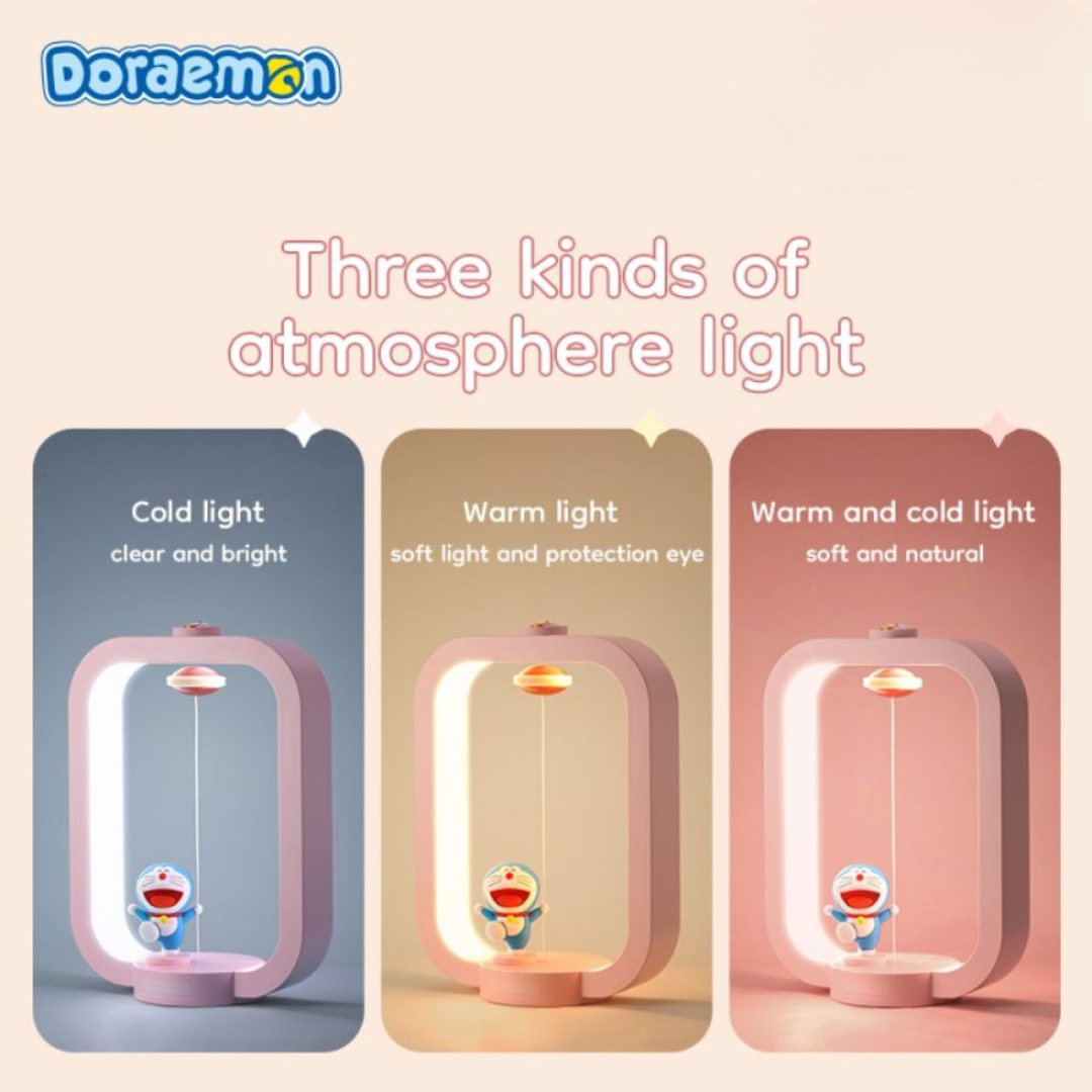 Doraemon Dorayaki magnetic night light displaying three lighting modes—cold light, warm light, and combined warm and cold light—each with a smiling Doraemon figure and floating dorayaki, shown in a modern pink frame