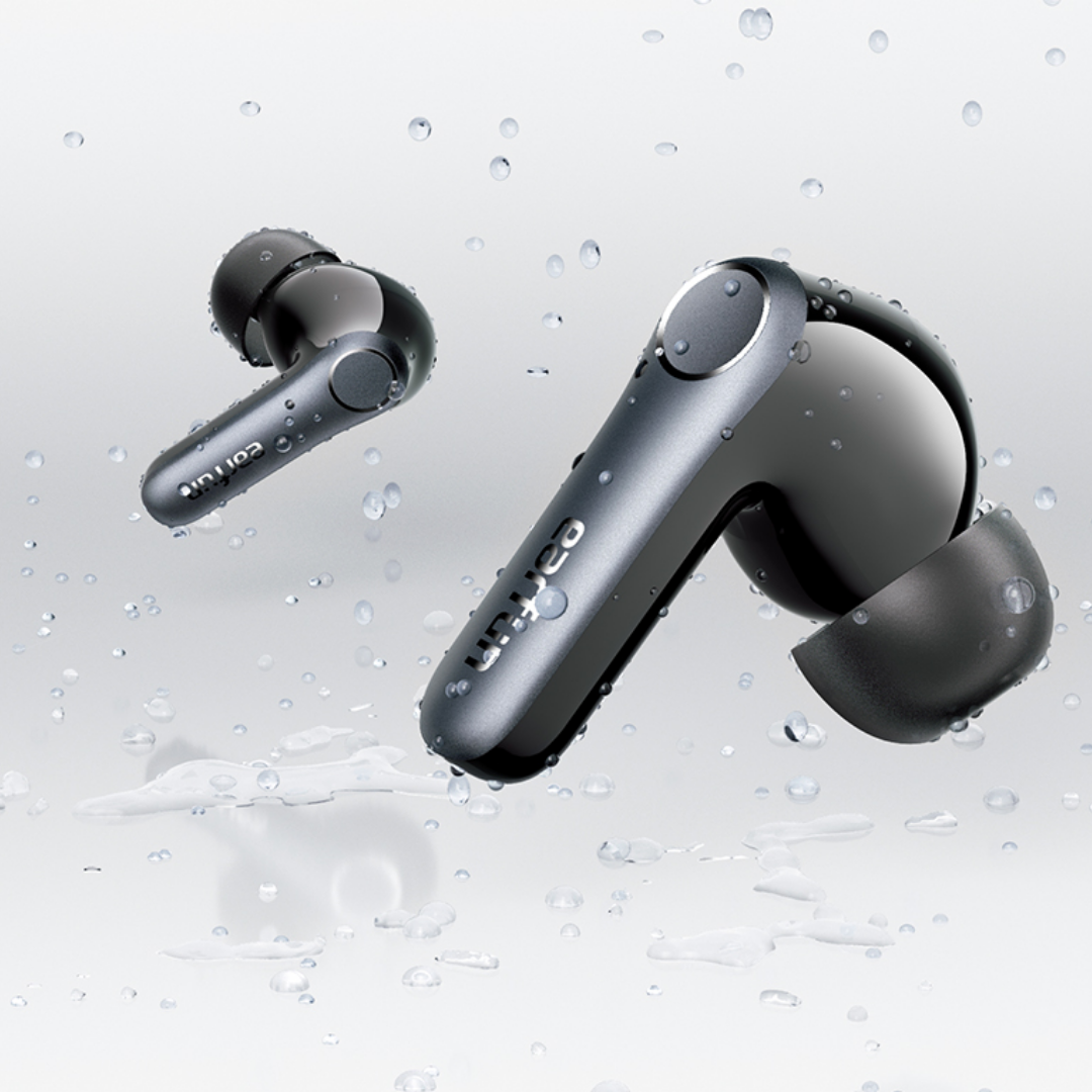Pair of EarFun Air Pro 4 wireless earbuds in dark grey, shown with water droplets to highlight their water resistance rating, floating against a light background