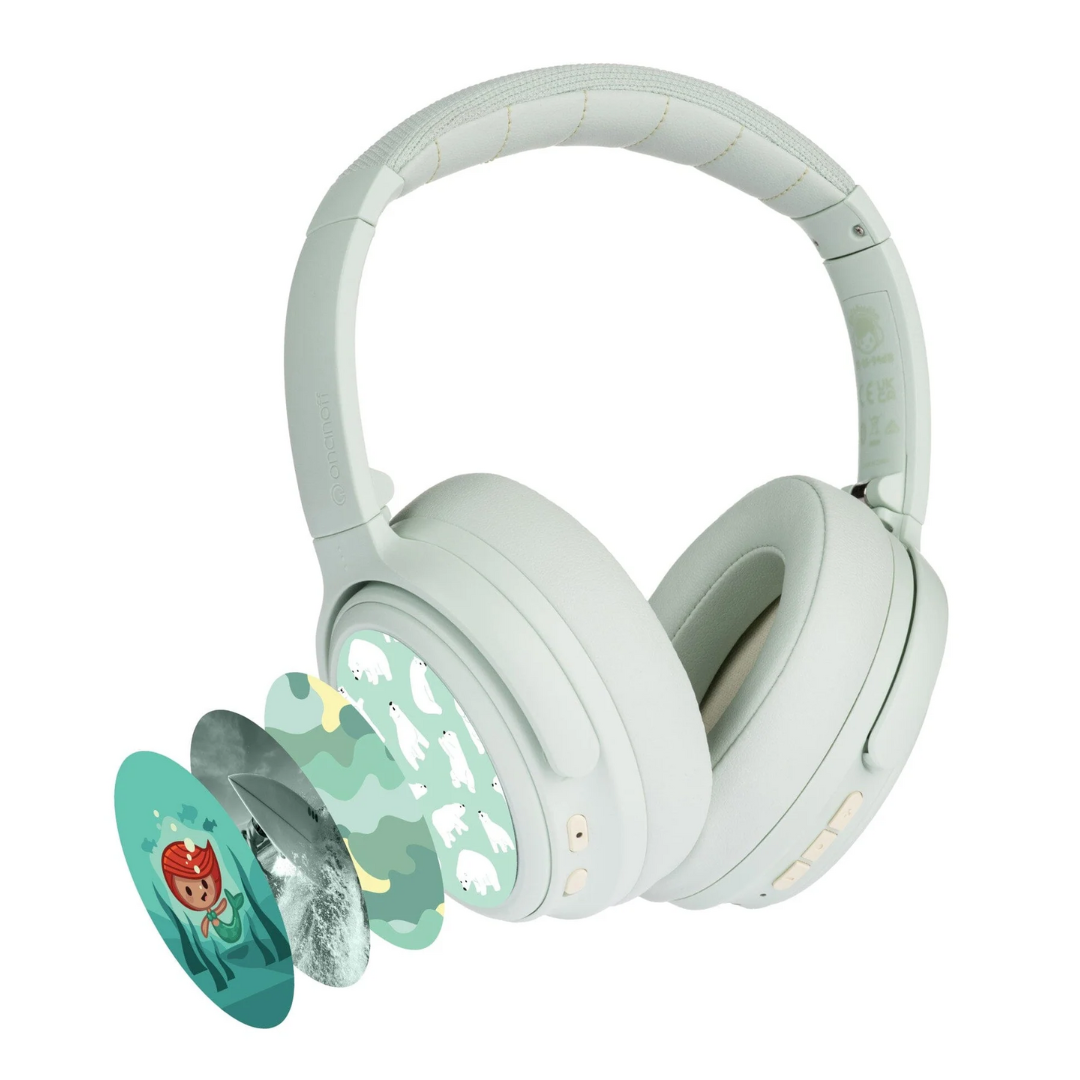 Grey army green BuddyPhones CosmosFun wireless kids headphones with active noise cancellation, shown with multiple decorative cover options including cartoon, polar bear, and camouflage designs