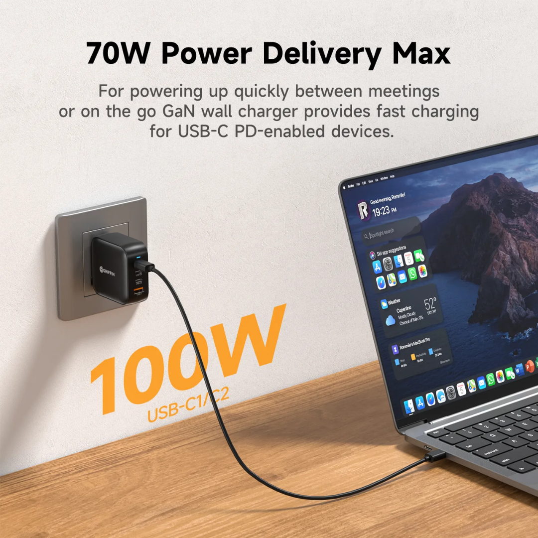 Griffin 100W GaN USB-C wall charger plugged in, delivering high-speed Power Delivery fast charging to a laptop, ideal for meetings and USB-C devices.