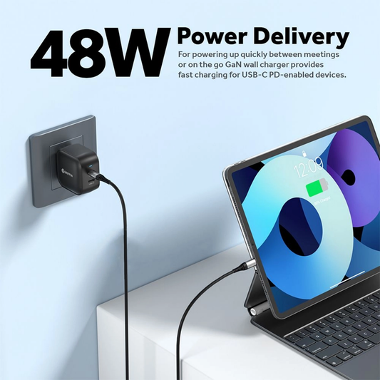 Griffin 48W GaN dual USB-C fast charger plugged into wall, charging a tablet with power delivery.