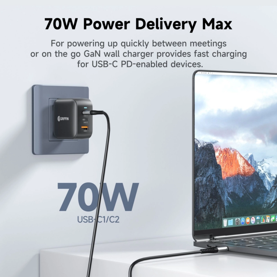Griffin 70W GaN USB-C wall charger plugged in, charging a laptop with Power Delivery for fast, efficient charging.