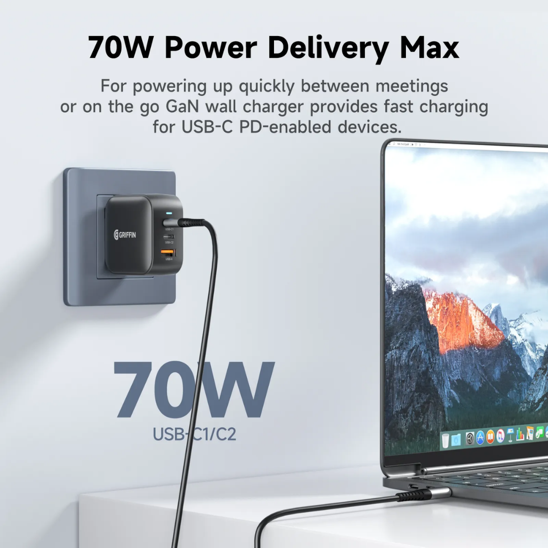 Griffin 70W GaN wall charger plugged into a power outlet, delivering fast USB-C Power Delivery to a laptop, ideal for quick and efficient device charging