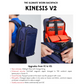 Kinesis V2 midnight blue work backpack with orange lining, shown worn on a woman’s back, featuring organized tech compartments and anti-theft YKK zipper details.