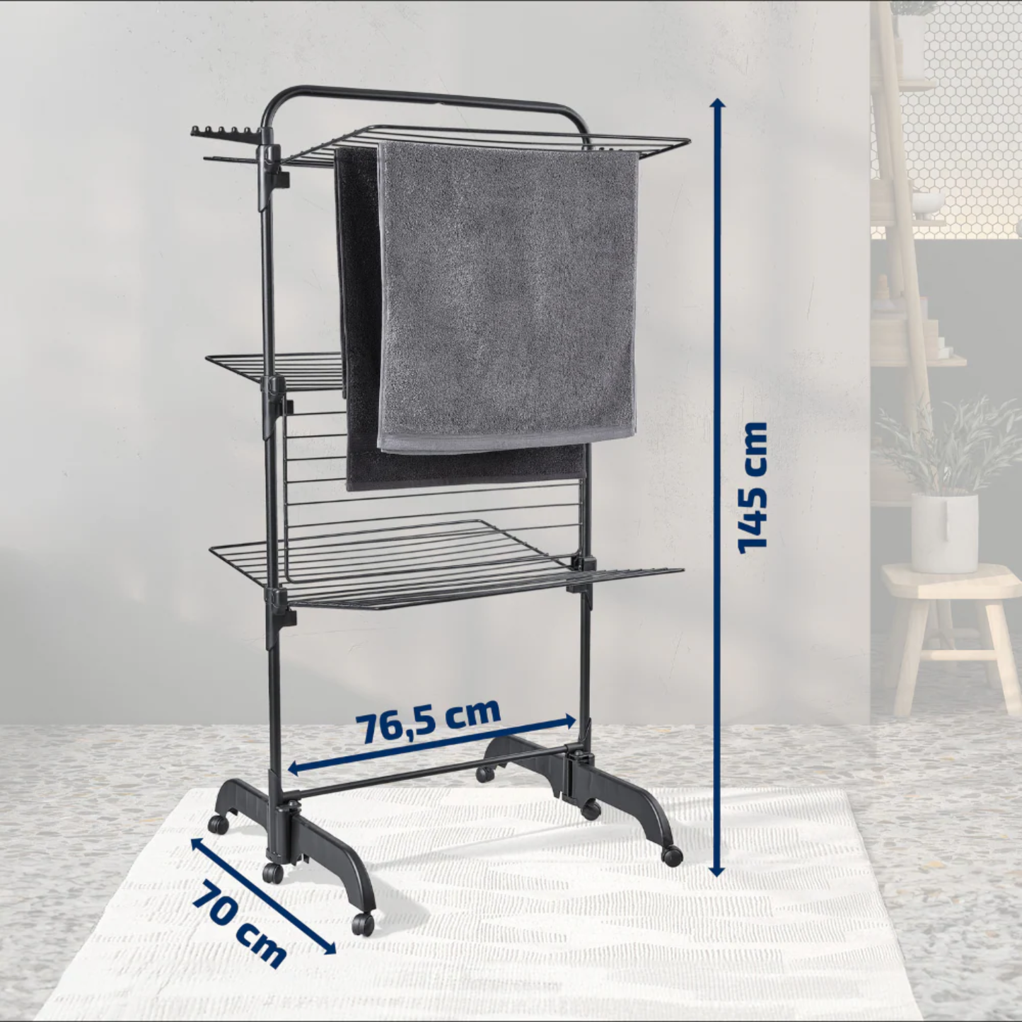 Leifheit Comfort Tower 420 Black three-tier laundry drying rack on wheels showing dimensions 145 cm high, 76.5 cm wide and 70 cm deep with towels hanging