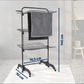 Leifheit Comfort Tower 420 Black three-tier laundry drying rack on wheels showing dimensions 145 cm high, 76.5 cm wide and 70 cm deep with towels hanging