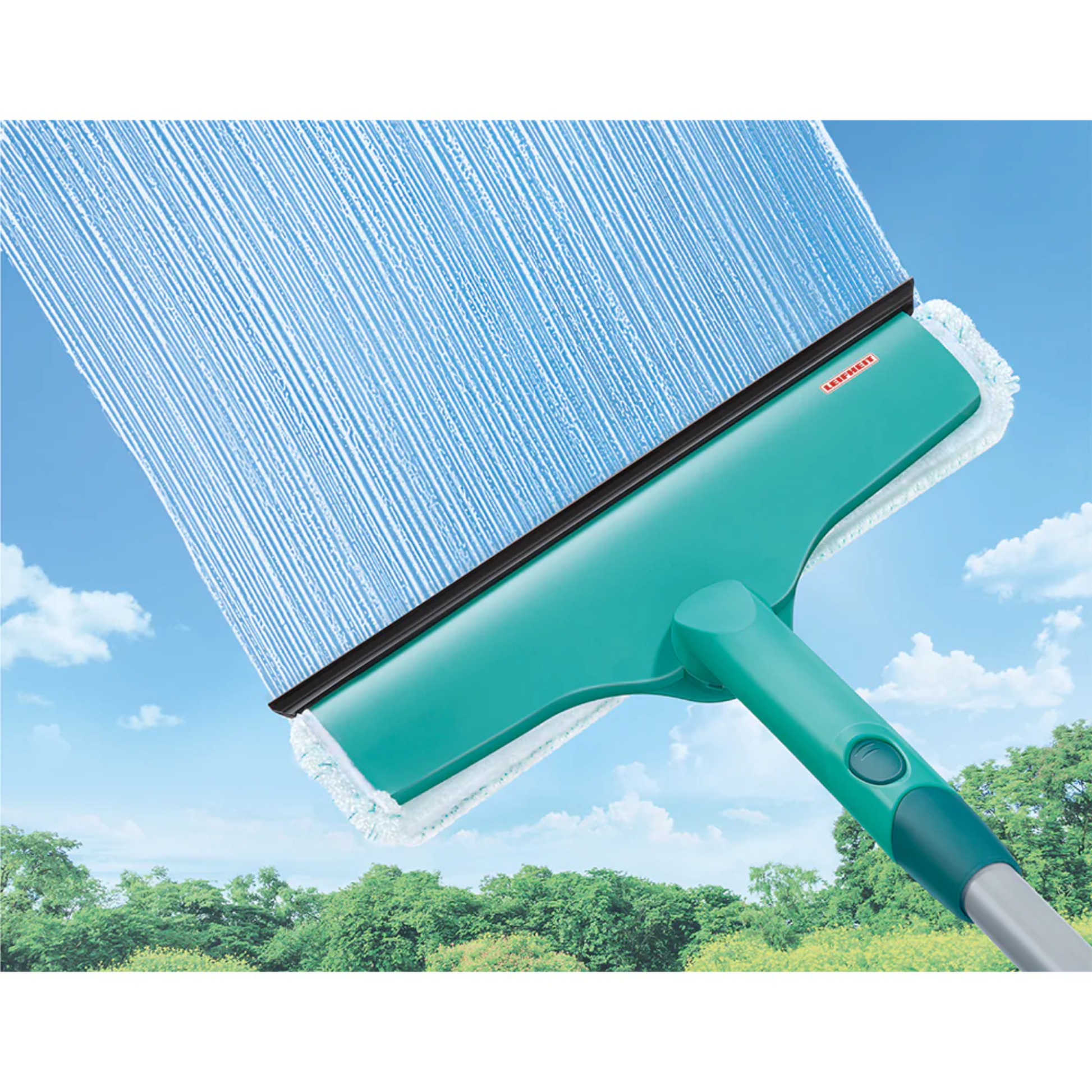 Leifheit L51120 Window & Frame Cleaner squeegee wiping soap from outdoor window for streak-free glass.