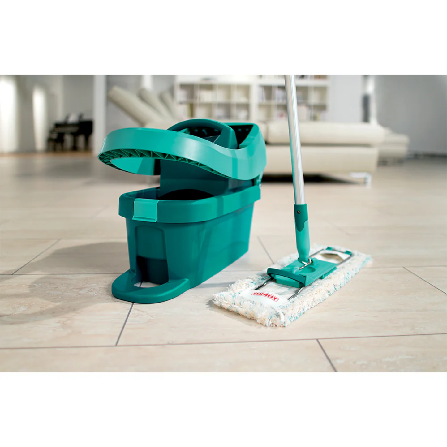 Leifheit Profi System Mop and 8L bucket with built-in press on a tiled living room floor.
