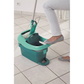 Person pressing the Leifheit Profi System mop in the foot-pedal press bucket to wring out water without using hands.