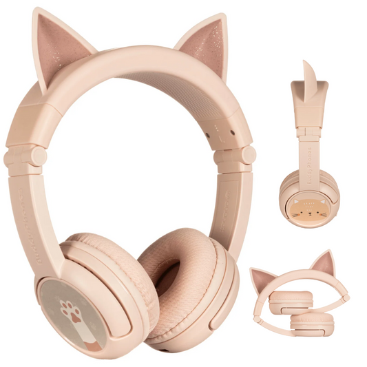 Light pink over-ear kids’ headphones with glittery cat ears on the headband, soft cushioned ear pads, and playful paw and cat face illustrations on the earcups; shown from front, side, and folded views