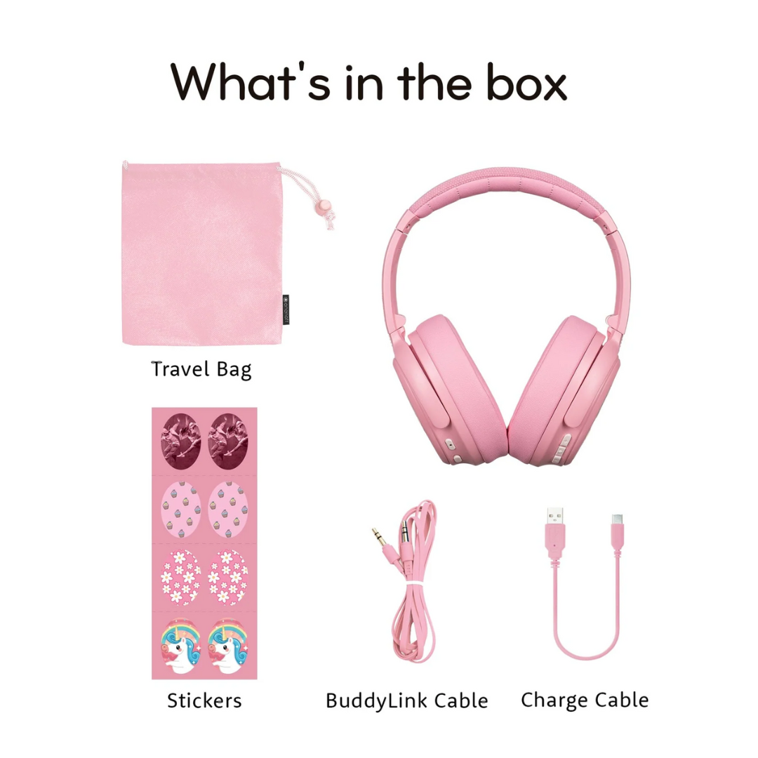 Flat lay of pink kids’ headphones and accessories on a white background, including a pink travel bag, a sheet of decorative stickers with unicorn and floral designs, a pink BuddyLink audio cable, and a pink USB charge cable, each item labeled