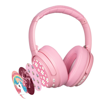 Pink wireless kids headphones with active noise cancellation, shown with multiple decorative sticker covers including flowers, cupcakes, unicorn, and rainbow designs