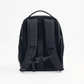 Back view of PYX black backpack showing padded shoulder straps, ergonomic back panel, and adjustable sternum strap for comfortable carrying.