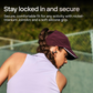 Woman with braided hair wearing a maroon cap and Shokz open-ear wireless earbuds playing tennis, showcasing a secure fit and athletic use outdoors.