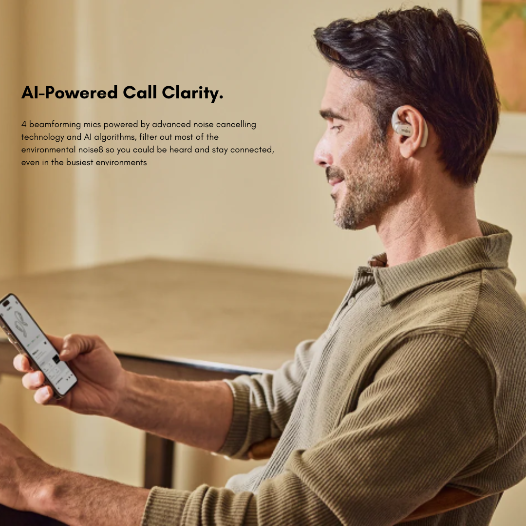 Person using Shokz open-ear wireless earbuds with smartphone, showcasing AI-powered call clarity and advanced noise cancelling microphones