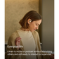 Woman using Shokz open-ear wireless earbuds, listening to music or podcast and ready to interact with others