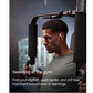 Person wearing Shokz open-ear wireless earbuds exercising on gym equipment and staying aware of surroundings