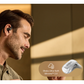 Man wearing Shokz open-ear wireless earbud made with Ultra-Soft Silicone 2.0 for comfortable fit