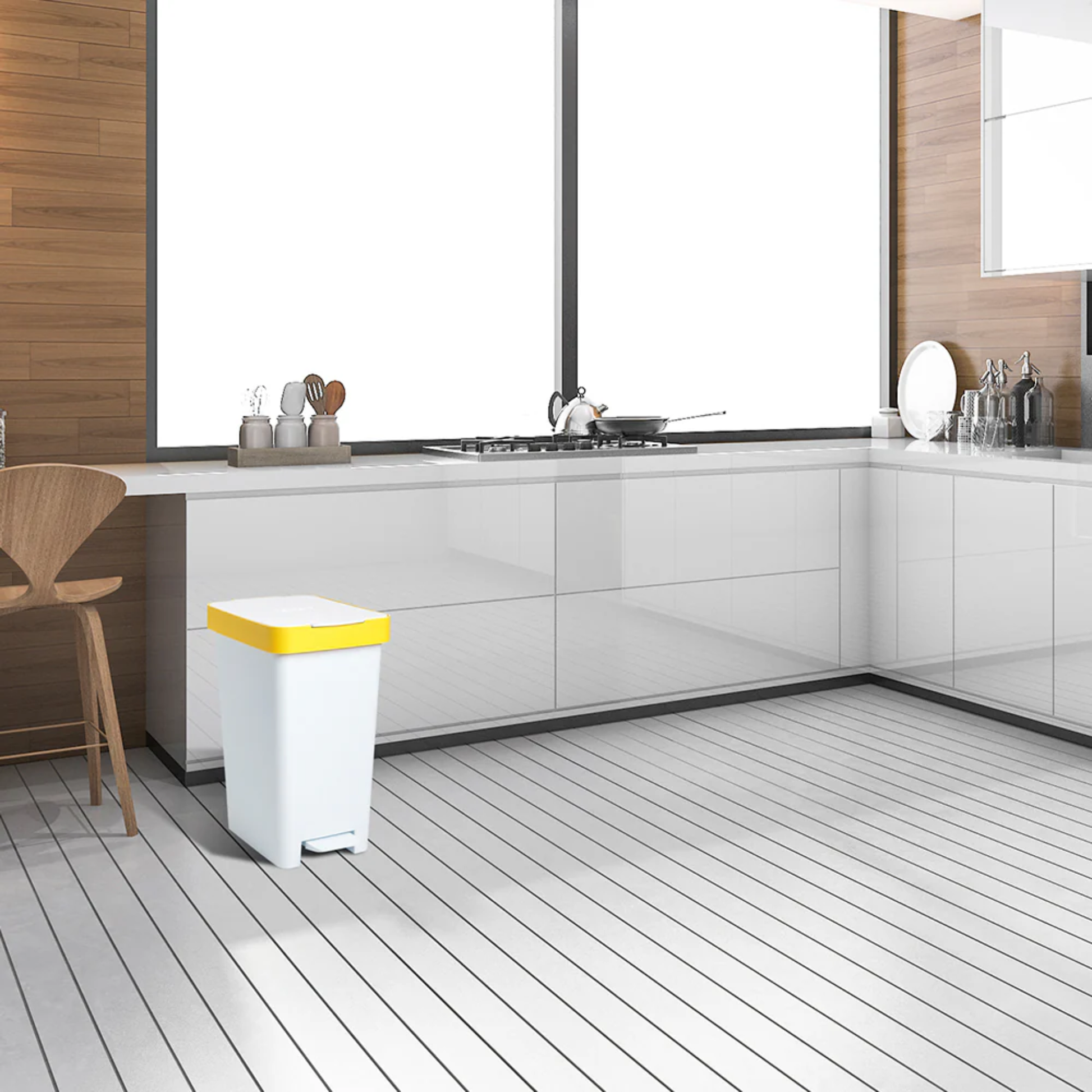 Modern white kitchen interior with Tatay 25L smart pedal bin featuring yellow lid for hygienic hands‑free rubbish disposal.