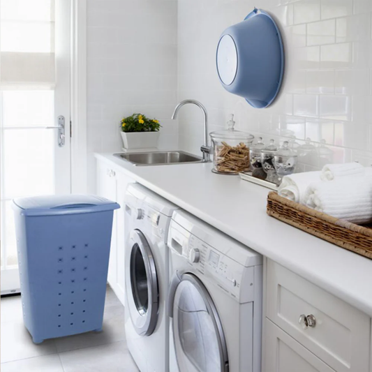 White laundry room with Tatay blue 60L ventilated laundry basket beside washing machines for organised clothes storage.