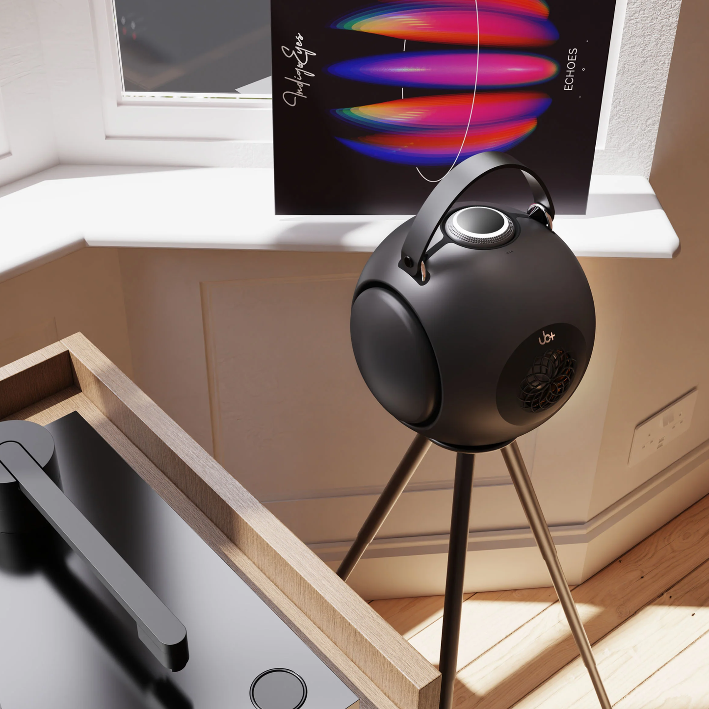 UB+ DB1 Doublebass portable speaker in metallic grey, positioned on a tripod stand near a window and next to a turntable in a well-lit modern room.