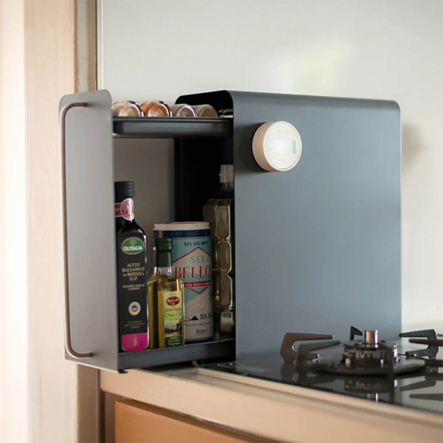 UtaU calm grey vertical stand drawer organizer hanging beside stove storing olive oil, vinegar and seasoning tins