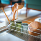 UtaU Dish Drainer Short calm gray over-the-sink rack holding plates, wooden board, glasses and utensils on modern kitchen island