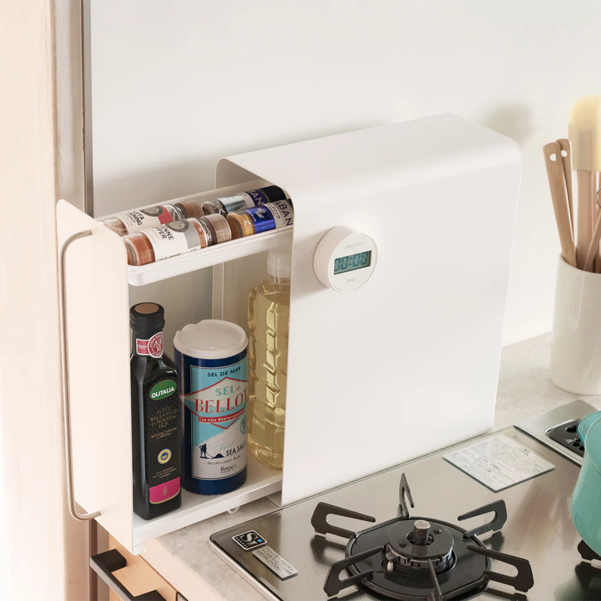 UtaU white vertical stand drawer organizer hanging beside stove storing cooking oil, salt and spice jars for compact kitchen storage