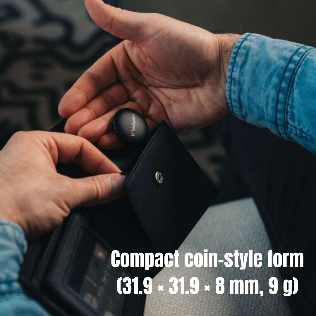 Person placing compact Verbatim Bluetooth coin tracker into wallet pocket, waterproof, Apple Find My compatible, ideal for tracking valuables