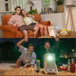 Yaber projector in home and outdoor settings, lifestyle photo with couples enjoying movies and snacks