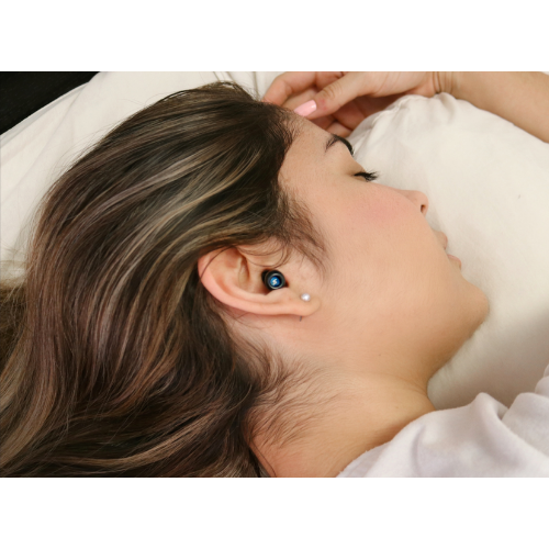 Person sleeping comfortably on their side with Attenu8 earplugs, demonstrating noise reduction and soft fit, available at Ideale Lifestyle e-commerce store