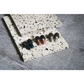 Attenu8 noise reduction earplugs in blue, rose gold, and silver colors displayed on stone textured surface for Ideale Lifestyle e-commerce store