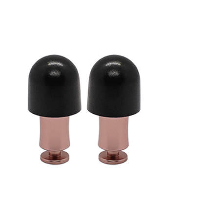 Close-up of Attenu8 rose gold noise reduction earplugs with black foam tips, ideal for sleep, study, and travel, available at Ideale Lifestyle e-commerce store
