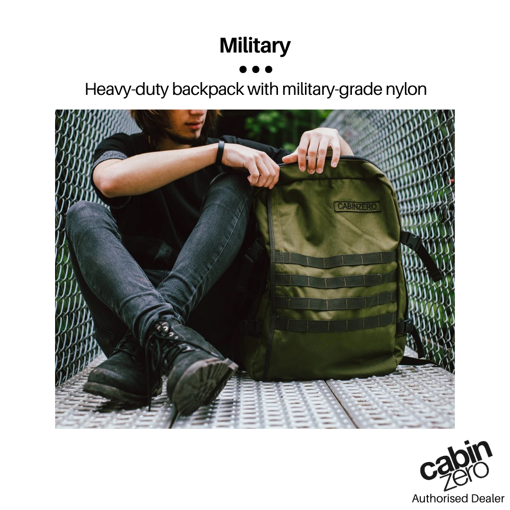CabinZero Military 44L Adventure Cabin Bag in olive green, heavy-duty nylon, featured in outdoor lifestyle setting with user on metal walkway
