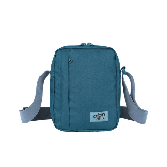 CabinZero Sidekick 3L Sling Bag in aruba blue, compact crossbody bag with adjustable strap, ideal for everyday essentials and travel