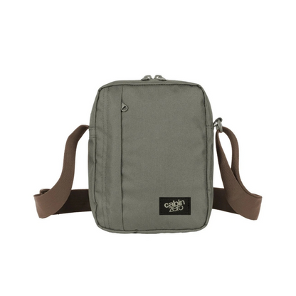 CabinZero Sidekick 3L Sling Bag in georgian khaki, compact lightweight crossbody bag with brown adjustable strap for casual or travel use