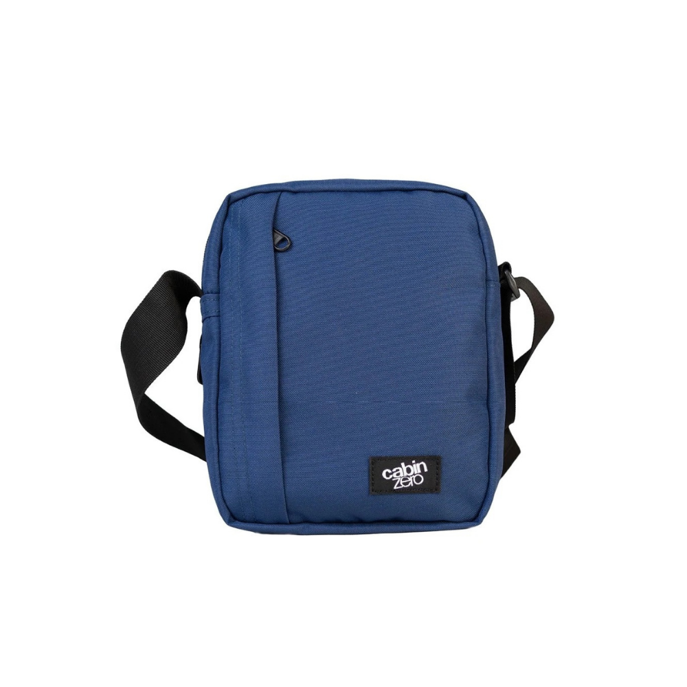CabinZero Sidekick 3L Sling Bag in navy blue, compact crossbody bag with black adjustable strap, ideal for daily use and travel