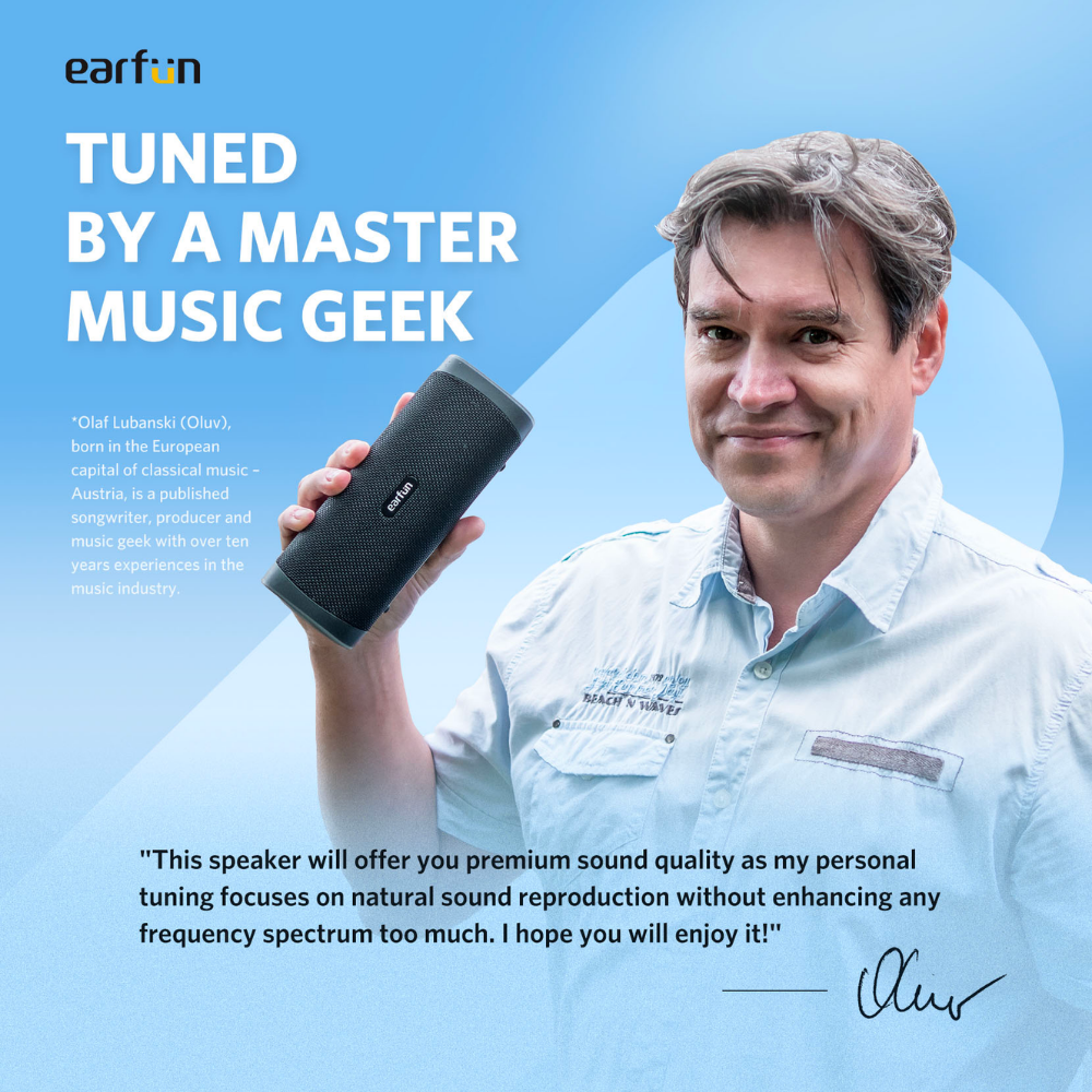 Person holding EarFun UBOOM L portable Bluetooth speaker, with text highlighting tuning by audio expert and focus on natural sound, on blue background