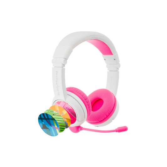 White and pink over-ear kids’ headphones with a pink detachable boom microphone, shown with four colorful interchangeable decorative discs fanned out beside the earcup