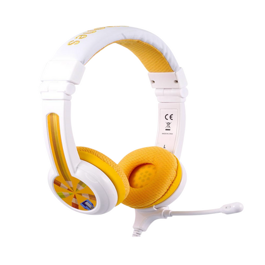 White and yellow over-ear kids’ headphones with a colorful geometric pattern on the earcups and a detachable boom microphone, shown on a white background